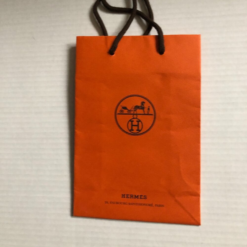 Hermes small orange paper gift bag; VG condition drawstring closure